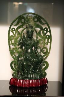 Appraisal: Green Seated Buddha Chinese Green jade in h The figure