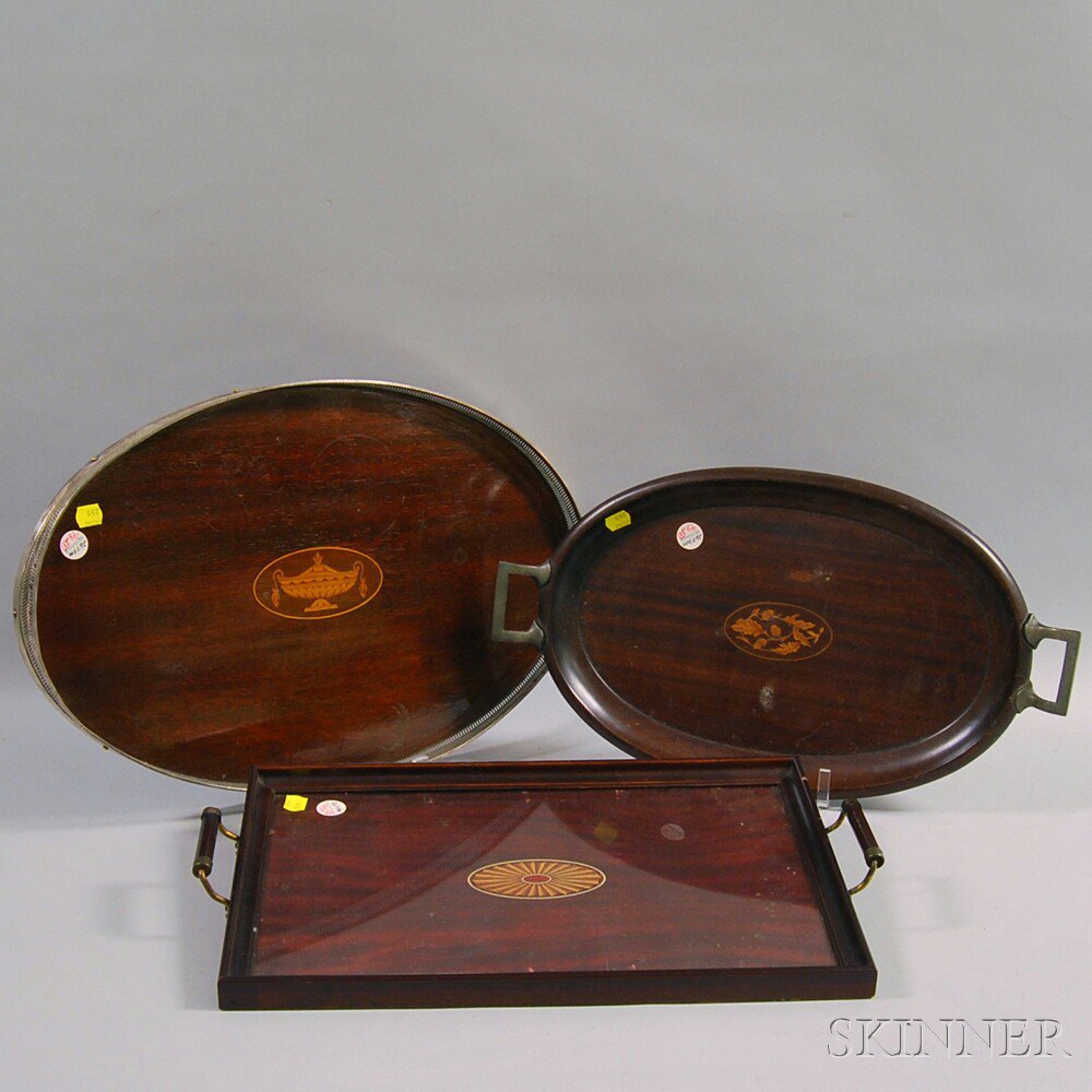 Appraisal: Three Inlaid Mahogany Trays th century an oval tray with