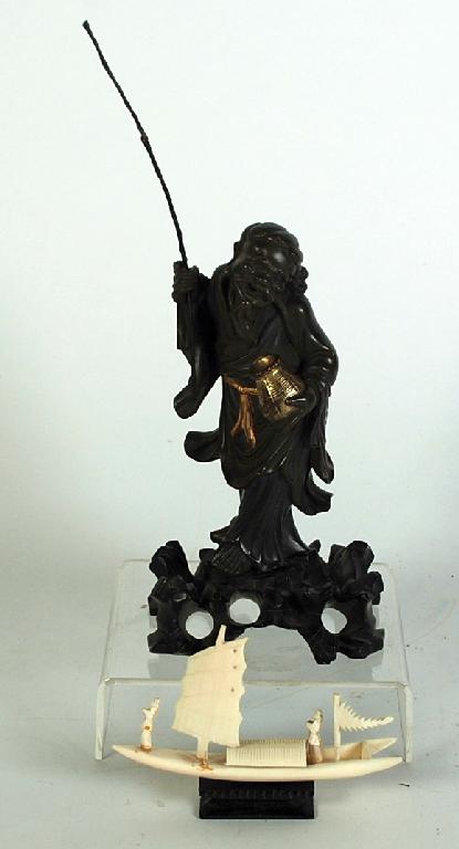 Appraisal: CHINESE COMPOSITE FIGURE of a fisherman modelled standing holding a