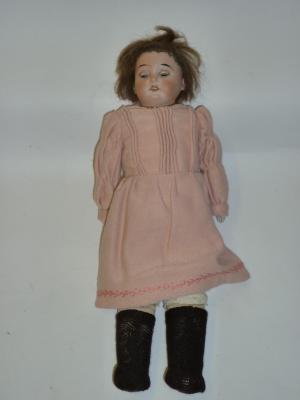 Appraisal: An Armand Marseille bisque shoulder head girl doll with blue