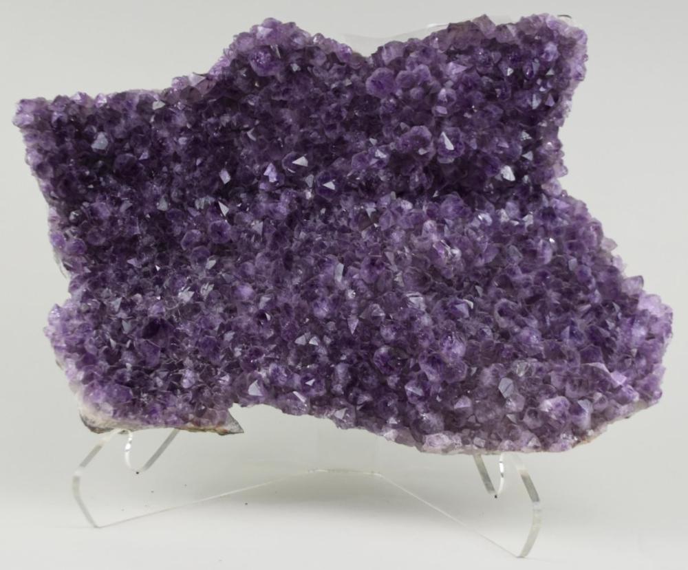 Appraisal: LARGE AMETHYST CRYSTAL GEODEAsymmetrical in form with both part colorless