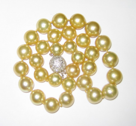 Appraisal: SOUTH SEA PEARL NECKLACE Gold color with largest pearl mm