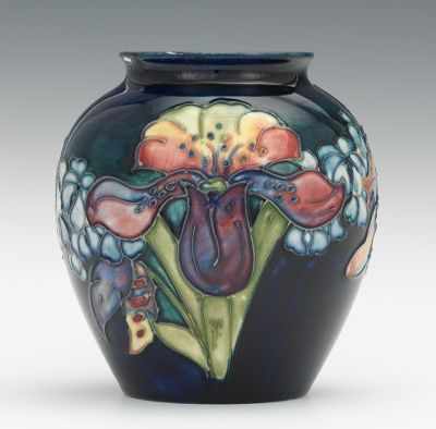 Appraisal: A Moorcroft Iris Vase Squat form with raised design of