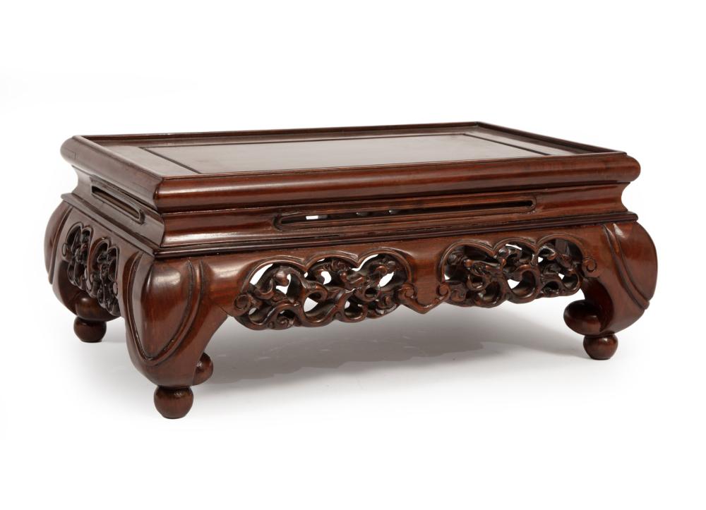 Appraisal: CHINESE HARDWOOD STANDChinese Hardwood Stand low table-form rectangular top pierced