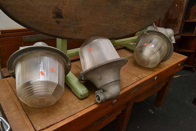 Appraisal: A SET OF FOUR ALUMINIUM AND GLASS INDUSTRIAL LIGHTS A