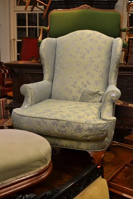 Appraisal: MORAN CONTEMPORARY WINGBACK CHAIR AND OTTOMAN MORAN CONTEMPORARY WINGBACK CHAIR