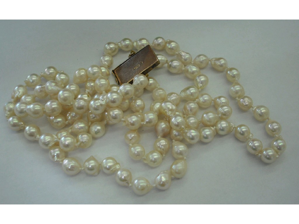 Appraisal: String of freshwater pearls with a ct engraved clasp mm