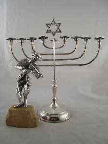 Appraisal: A plated menorah x cm high and a silver cased