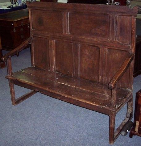 Appraisal: An th Century oak settle with seven panels to back