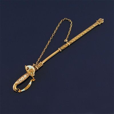 Appraisal: An enamelled gold jabot pin in the form of a