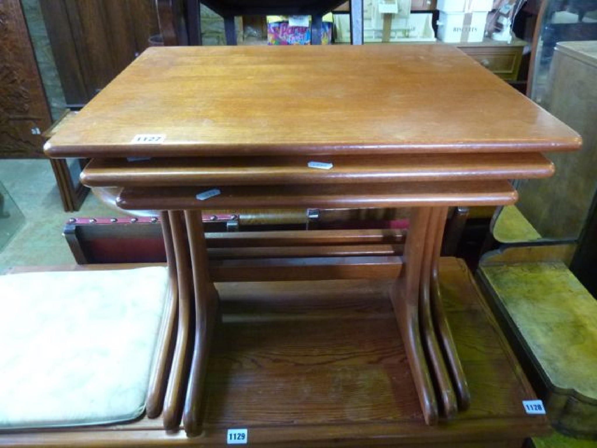 Appraisal: A nest of three mid th century teak graduated occasional