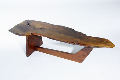 Appraisal: GEORGE NAKASHIMA Fine sled-based walnut coffee table its beautifully-grained free-edge