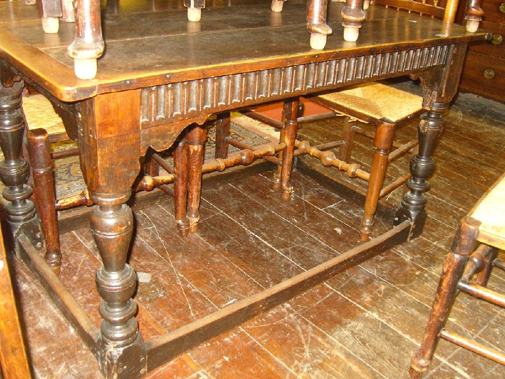 Appraisal: An antique oak refectory table the rectangular boarded top with