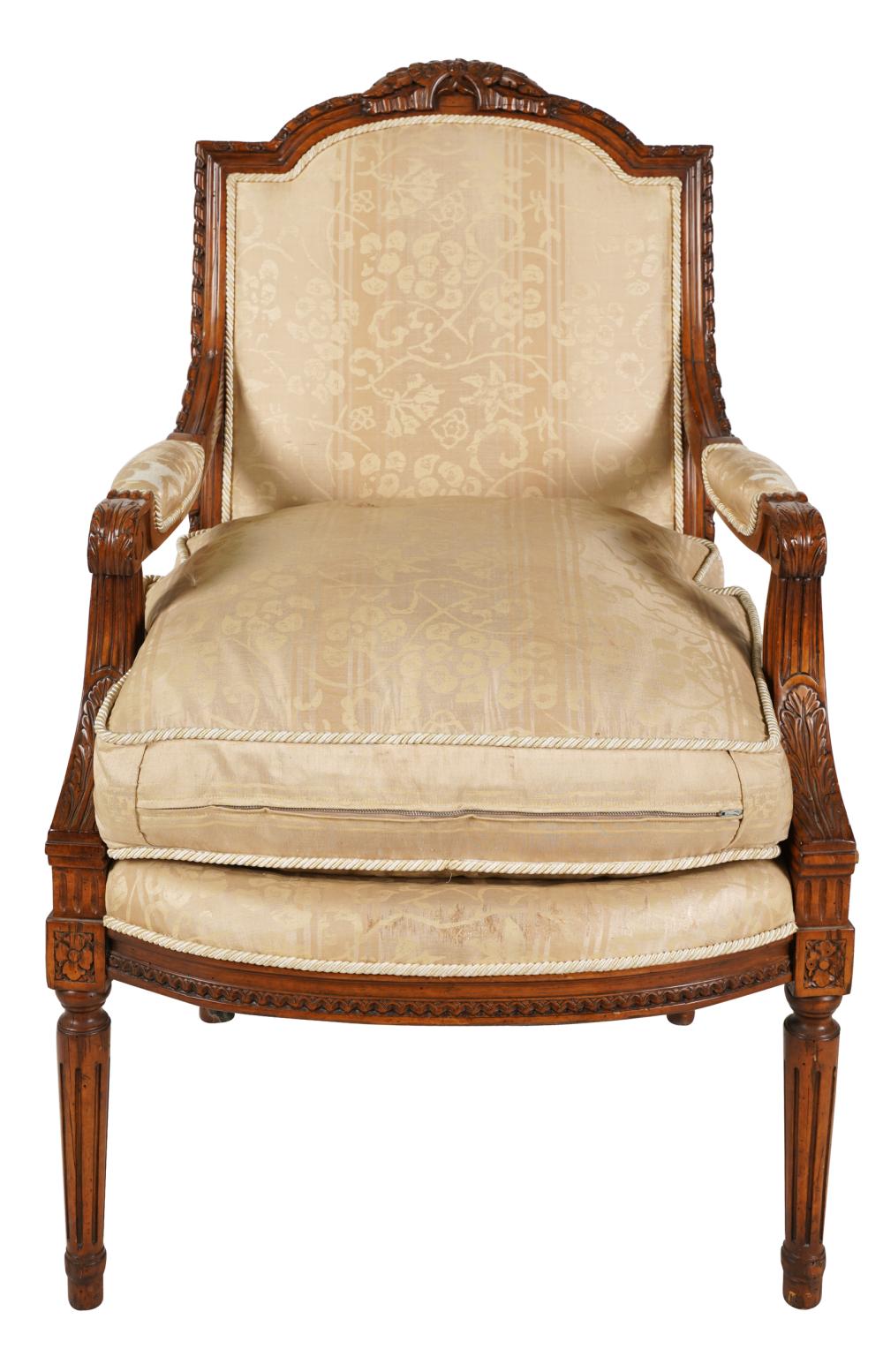 Appraisal: LOUIS XVI- STYLE CARVED WALNUT FAUTEUILcovered with beige silk inches