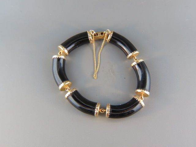 Appraisal: Black Jade k Gold Bracelet cylinderacal designs yellow gold