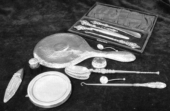 Appraisal: A cased dressing set comprising glove stretcher shoe horn and