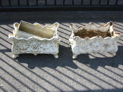 Appraisal: A PAIR OF FRENCH STYLE CAST IRON GARDEN PLANTERS c