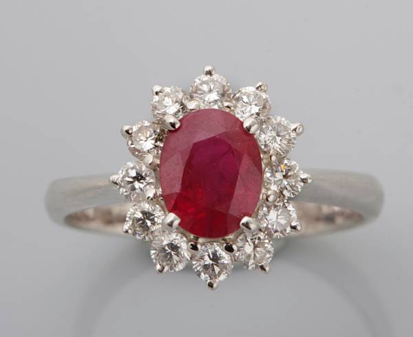 Appraisal: property of various owners centering an oval ruby with a