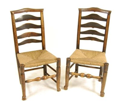 Appraisal: Four th century ash ladderback chairs each with a rush