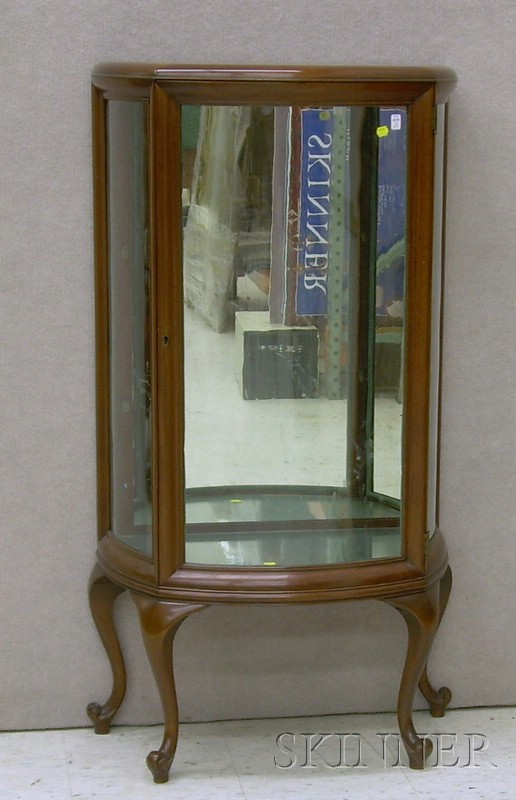 Appraisal: Rococo-style Mahogany Swell-front Vitrine fitted for two fixed shelves ht