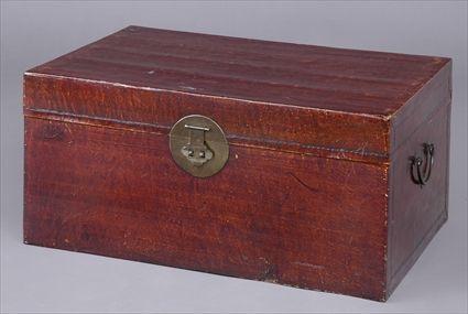 Appraisal: CHINESE BRASS-MOUNTED MAROON-STAINED PIGSKIN COVERED CHEST With circular lock plate