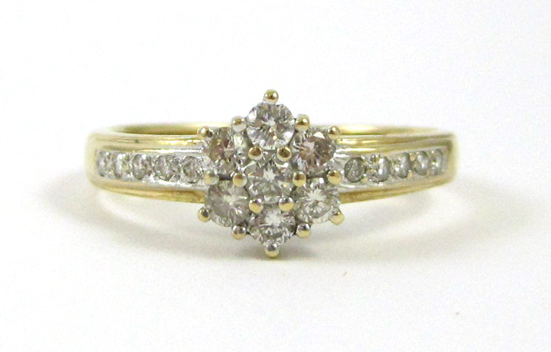 Appraisal: DIAMOND AND FOURTEEN KARAT GOLD RING set with round-cut diamonds