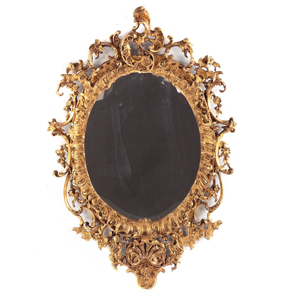 Appraisal: Baroque Style Giltwood Mirror th century openwork frame with plume