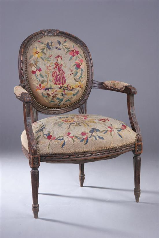 Appraisal: LOUIS XVI STYLE CARVED FRUITWOOD FAUTEUIL early th century with