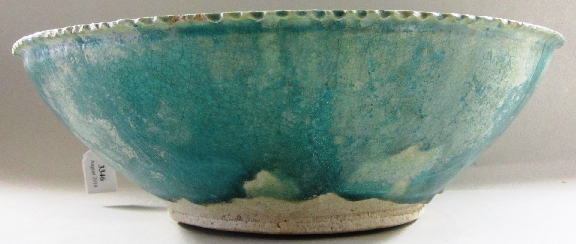 Appraisal: A large Kashan incised turquoise blue glazed bowl central Iran