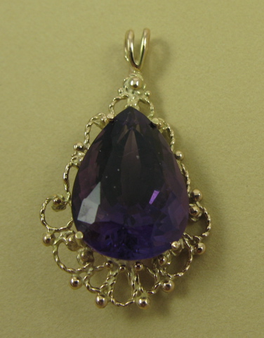 Appraisal: AMETHYST AND FOURTEEN KARAT GOLD PENDANT set with a single