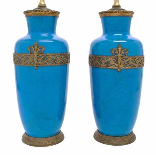 Appraisal: A Pair of Gilt Metal Mounted Earthenware Lamps each of