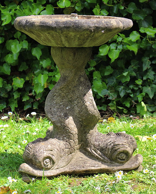 Appraisal: A CAST CONCRETE SMALL FOUNTAIN HEAD with a shallow bowl