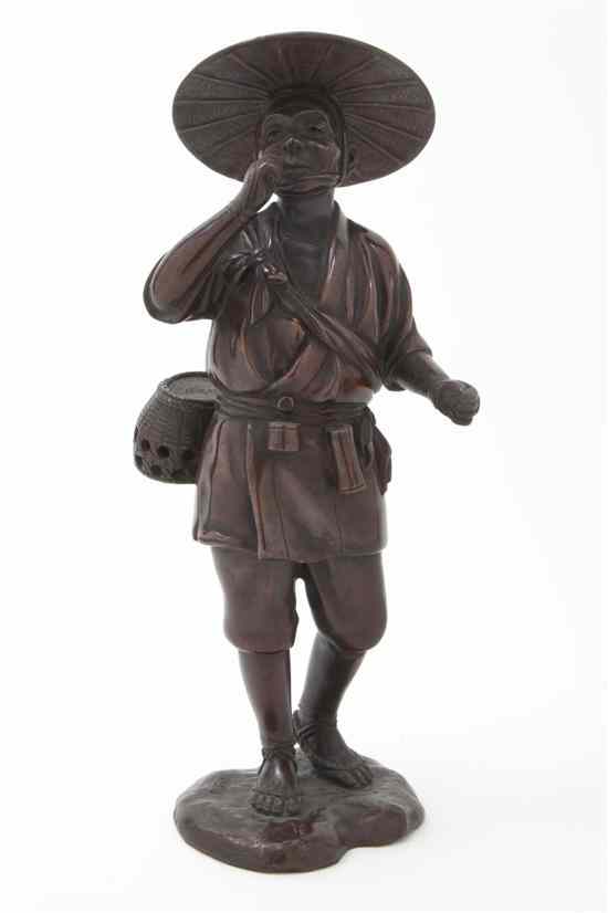 Appraisal: A Japanese Bronze Figure of a Man depicted wearing a