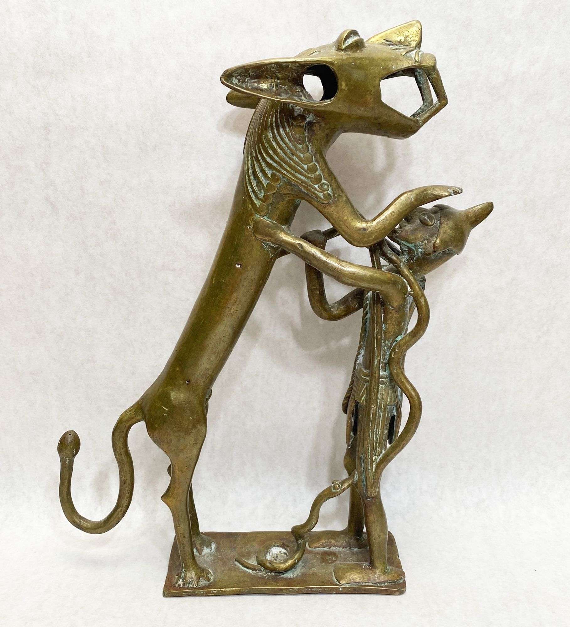 Appraisal: West African Bronze Warrior and Lion Figure tall believed to