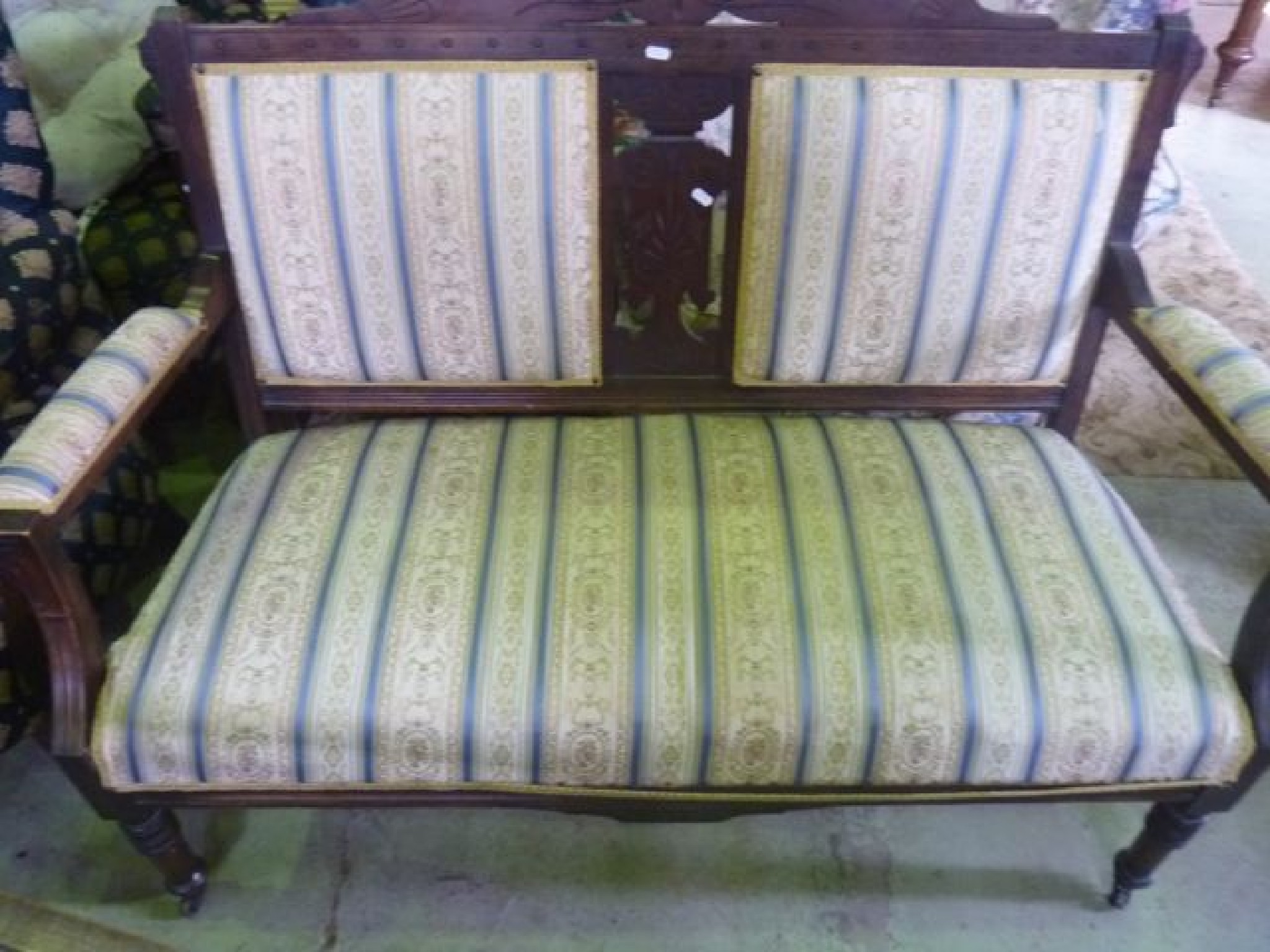 Appraisal: A late Victorian two seat parlour sofa with alternating striped