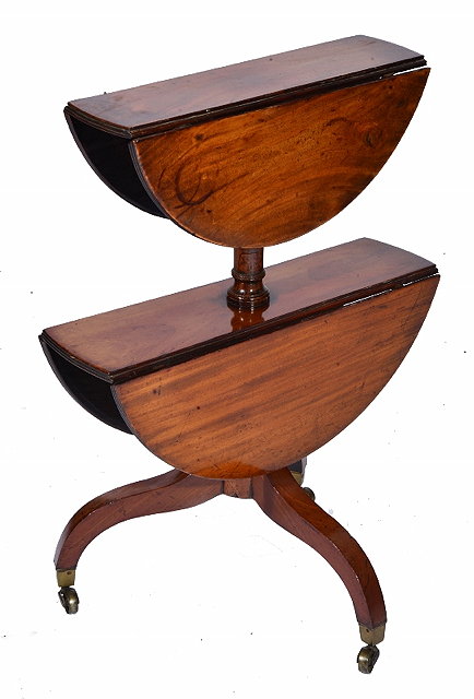 Appraisal: A REGENCY MAHOGANY TWO TIER DROP FLAP DUMB WAITER each