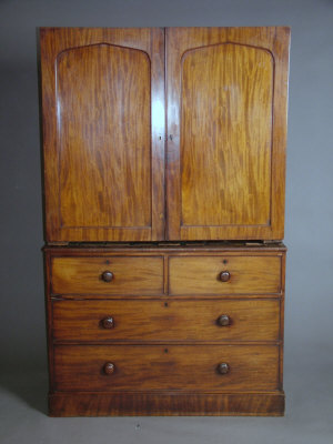 Appraisal: A mid- th century mahogany linen press the arched panelled