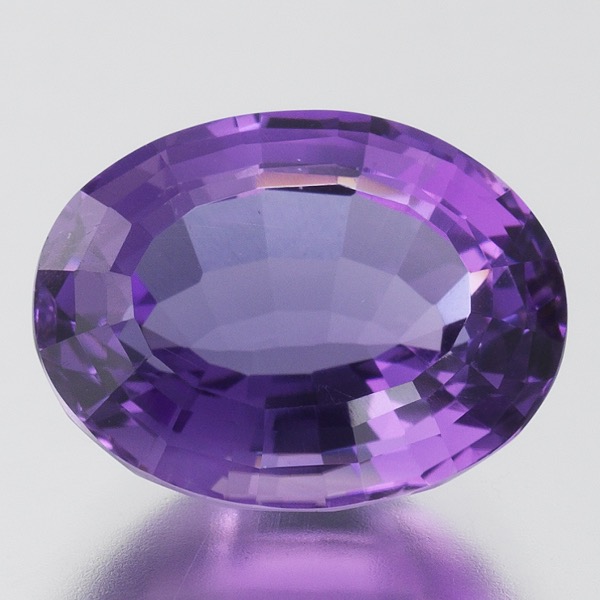 Appraisal: UNMOUNTED OVAL STEP CUT AMETHYST mm x mm x mm