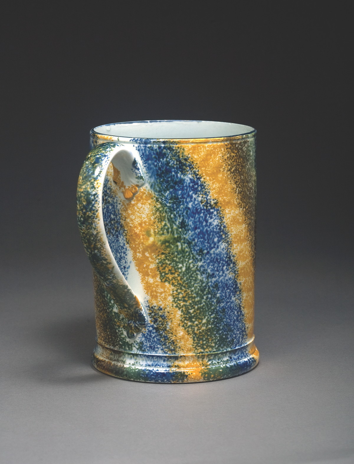 Appraisal: FINE STAFFORDSHIRE 'RAINBOW' PATTERN QUART MUG CIRCA Surrounded by ochre