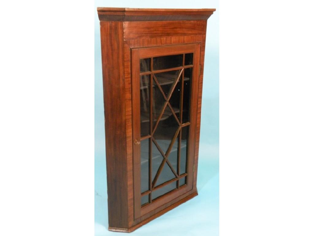 Appraisal: A George III mahogany and cross banded corner cabinet with