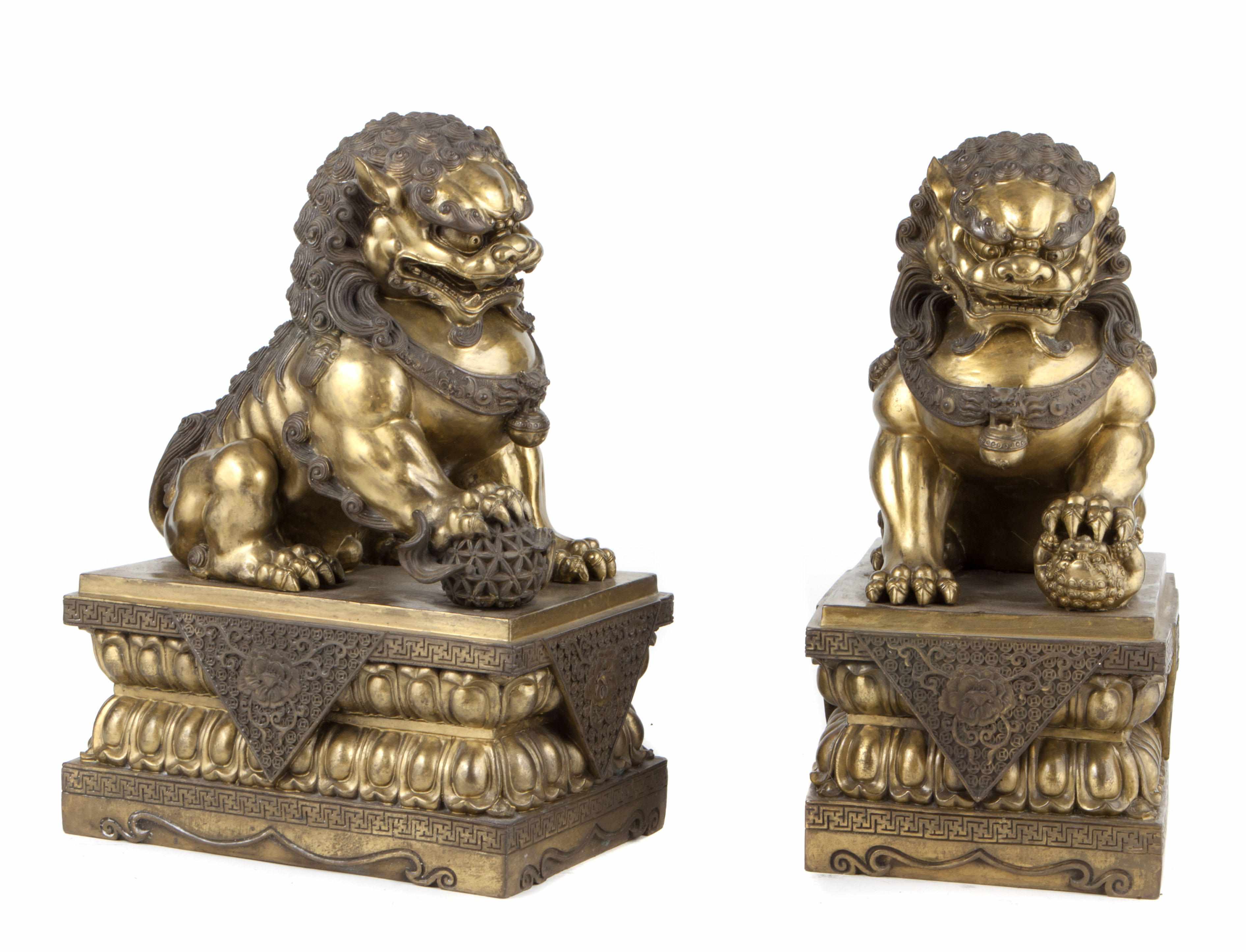 Appraisal: A pair of Chinese models of Fu lions height in