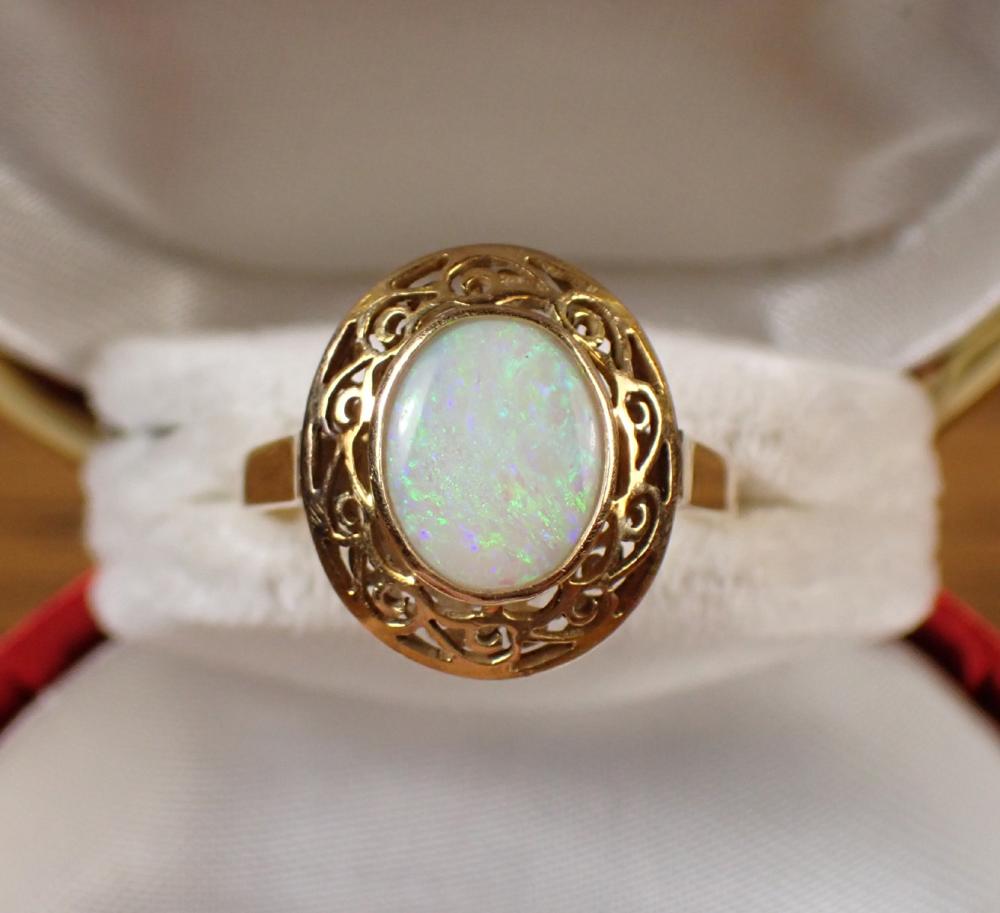 Appraisal: OPAL AND EIGHTEEN KARAT GOLD RING bezel set with an