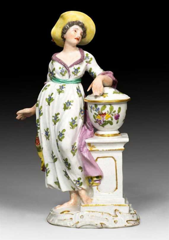 Appraisal: FIGURE OF A WOMAN WITH A PEDESTAL Meissen circa Underglaze