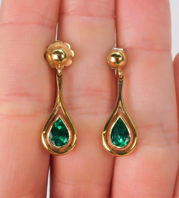 Appraisal: K GOLD CHANNEL SET PEAR SHAPE EMERALD EARRINGS United States