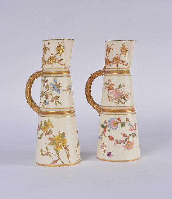 Appraisal: A pair of Royal Worcester blush ivory jugslate th Centurypattern