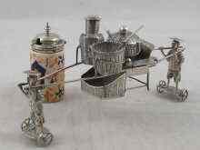 Appraisal: A Chinese silver cruet in the form of two men