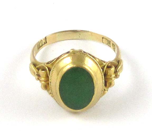 Appraisal: GREEN JADE AND TWENTY-TWO KARAT GOLD RING having an oval