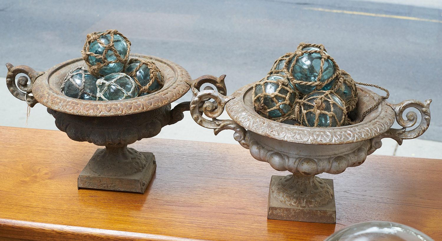 Appraisal: TWO th CENTURY CAST IRON URNS Silver paint work to