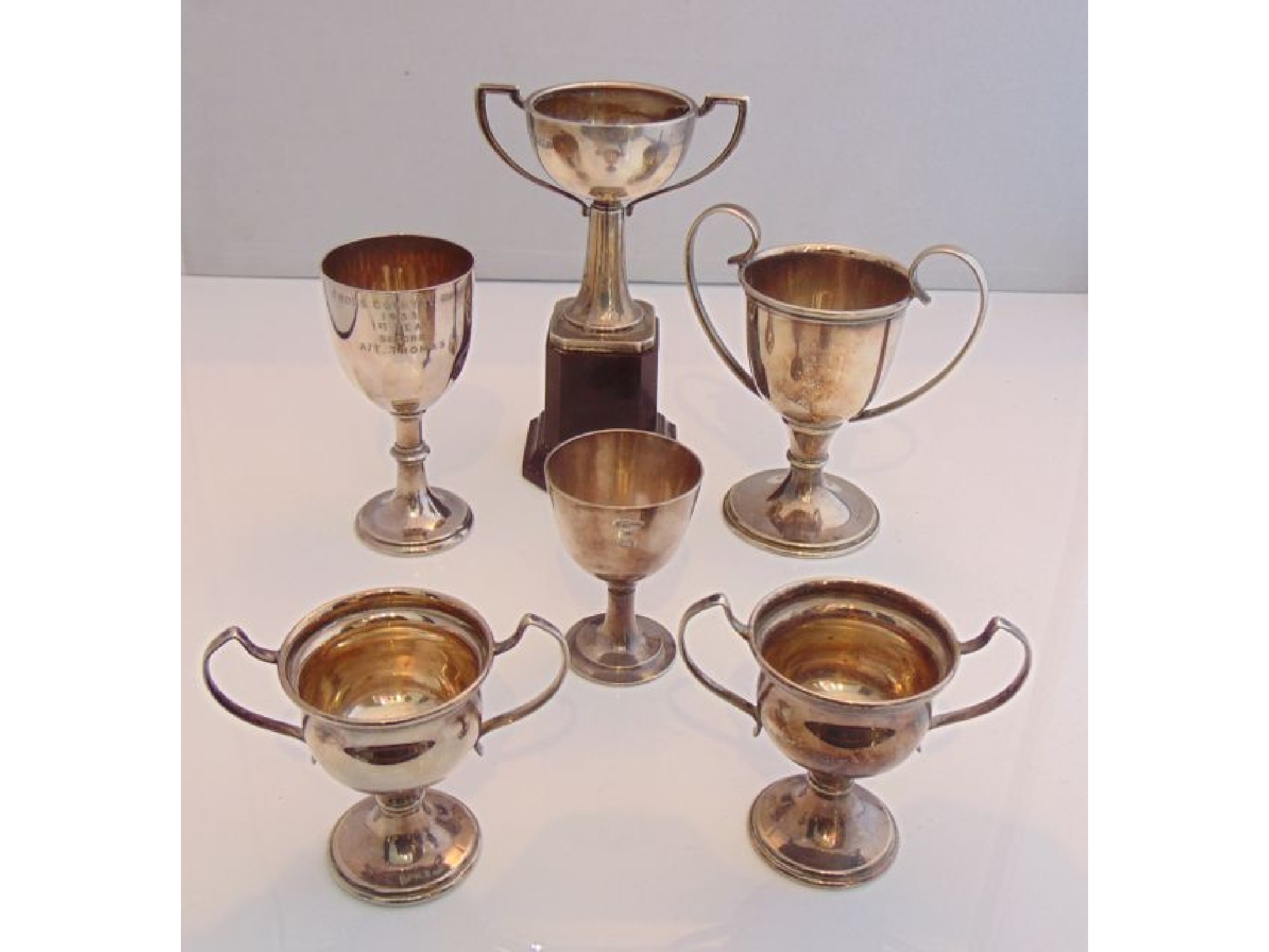 Appraisal: A silver trophy cup Birmingham attached to a plinth with