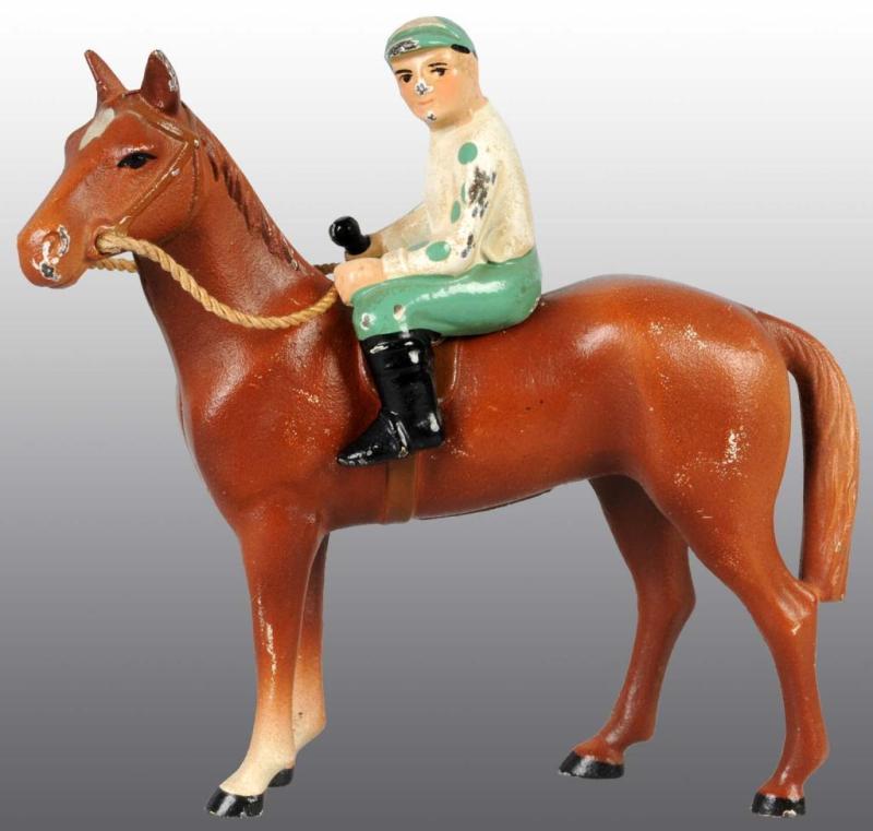 Appraisal: Cast Iron Horse Jockey Novelty Description Made by Hubley cat